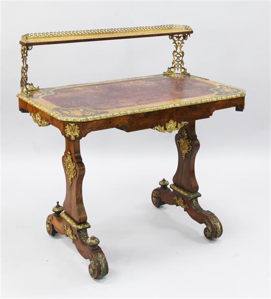 A Victorian marquetry inlaid figured walnut writing table, W.3ft D.1ft 9in. H.3ft 1in.